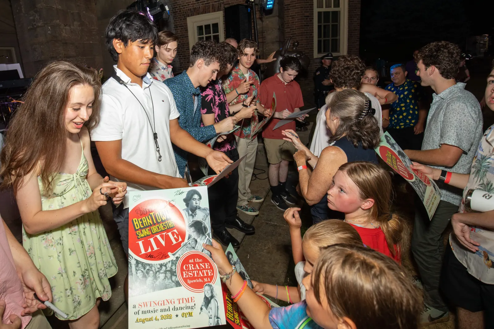 Emma and Beckett signing autographs